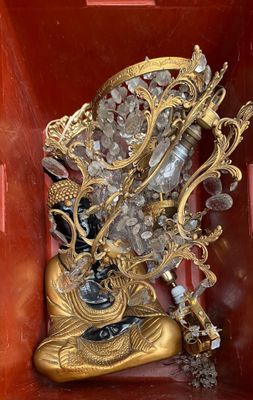 a gold statue of a shoe with a bunch of crystals in it
