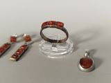 several pieces of jewelry including a ring, earrings, and a ring