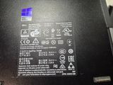 a close up of a black laptop with a blue screen