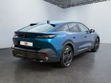 the rear end of a blue toyota c - hr in a white room