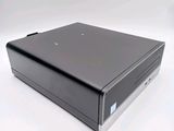 an image of a small black computer on a white surface