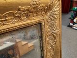 a mirror that is sitting on the floor in the room