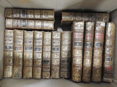 many old books in a box on the table