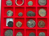 a red tray with a bunch of coins in it