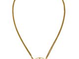 a gold necklace with a cross on a chain