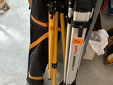 two tripods and a bag on the floor