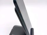 a close up of a cell phone on a stand