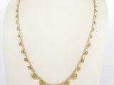 a gold necklace on a mannequin mannequin mannequin mannequin mannequin mannequin mannequin mannequin mannequin