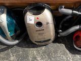 several vacuums are lined up next to each other on the floor