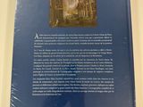 the back cover of a book with a picture of a church in the background