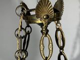 a brass chandelier hanging from the ceiling