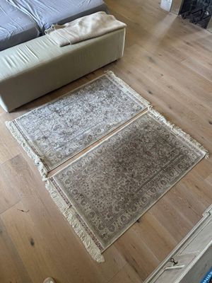 a couch and a rug on the floor in a living room
