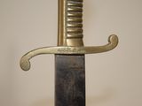 a close up of a sword with a metal handle