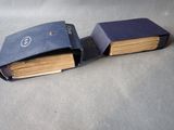 two open books sitting on a table next to each other