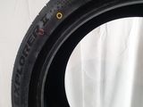 a close up of a tire on a white surface with a white background