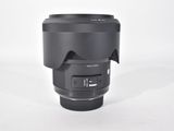 a close up of a lens on a white surface with a white background