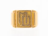 a close up of a gold ring with the letter d on it
