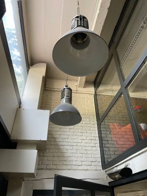 two lamps hanging from the ceiling in a room