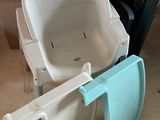 a baby seat that is sitting on the floor