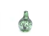 two green vases sitting next to each other on a white surface