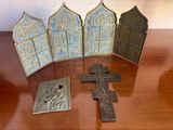four crosses and a plaque on a table