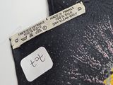 an image of a label on a tie with a picture of a sun