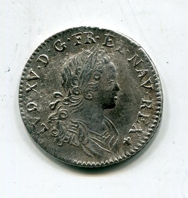 une vieille pièce d'argent avec un visage de femme dessus