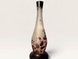an image of a vase on a stand on a white background