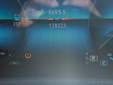 a close up of a car dashboard with various gauges and numbers
