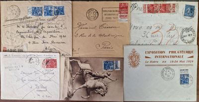 several old postcards and envelopes on a table with stamps on them