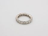 a close up of a silver ring on a white surface