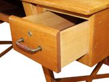 a wooden desk with a drawer on top of it