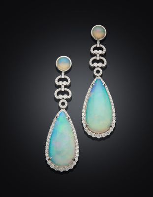 a pair of oplite and diamond earrings