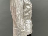 an image of a mannequin wearing a silver jacket and black pants