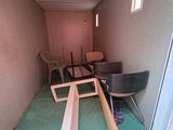 a room that has a chair and a table in it