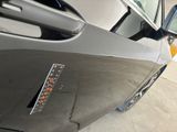 a close up of a car door with a sticker on it