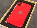 an apple red iphone is in a box on a table