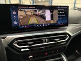 the interior of a car with a large screen showing a car ' s parking system