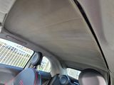 the interior of a car with two seats and a steering wheel