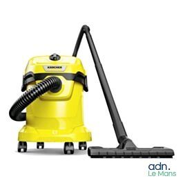 a close up of a yellow vacuum cleaner with a black hose