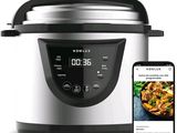 an electric pressure cooker with a smart phone next to it