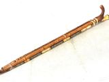 a wooden stick that is sitting on a white surface