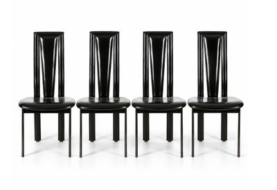 four black dining chairs with black leather seats and a white background