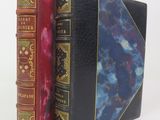 two books sitting next to each other on a white surface