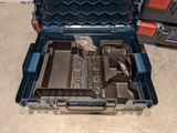 a tool box with tools inside of it on the floor