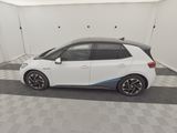 the bmw i3 is parked in a garage with a checkered floor