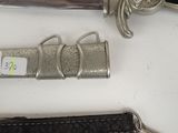 a knife and a keychain sitting on a table