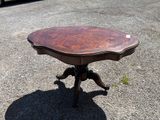 a small table that is sitting in the middle of a parking lot