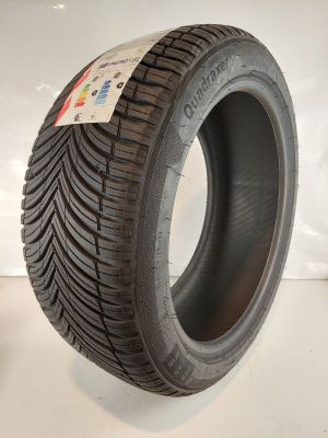 a close up of a tire on a white surface