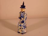 a figurine of a man in a blue and white outfit
